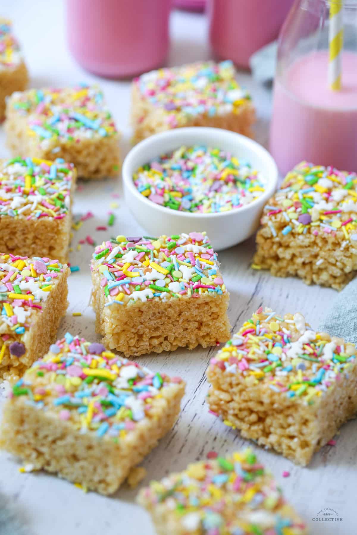 rice bubble slice cut into squares and topped with sprinkles on a white table