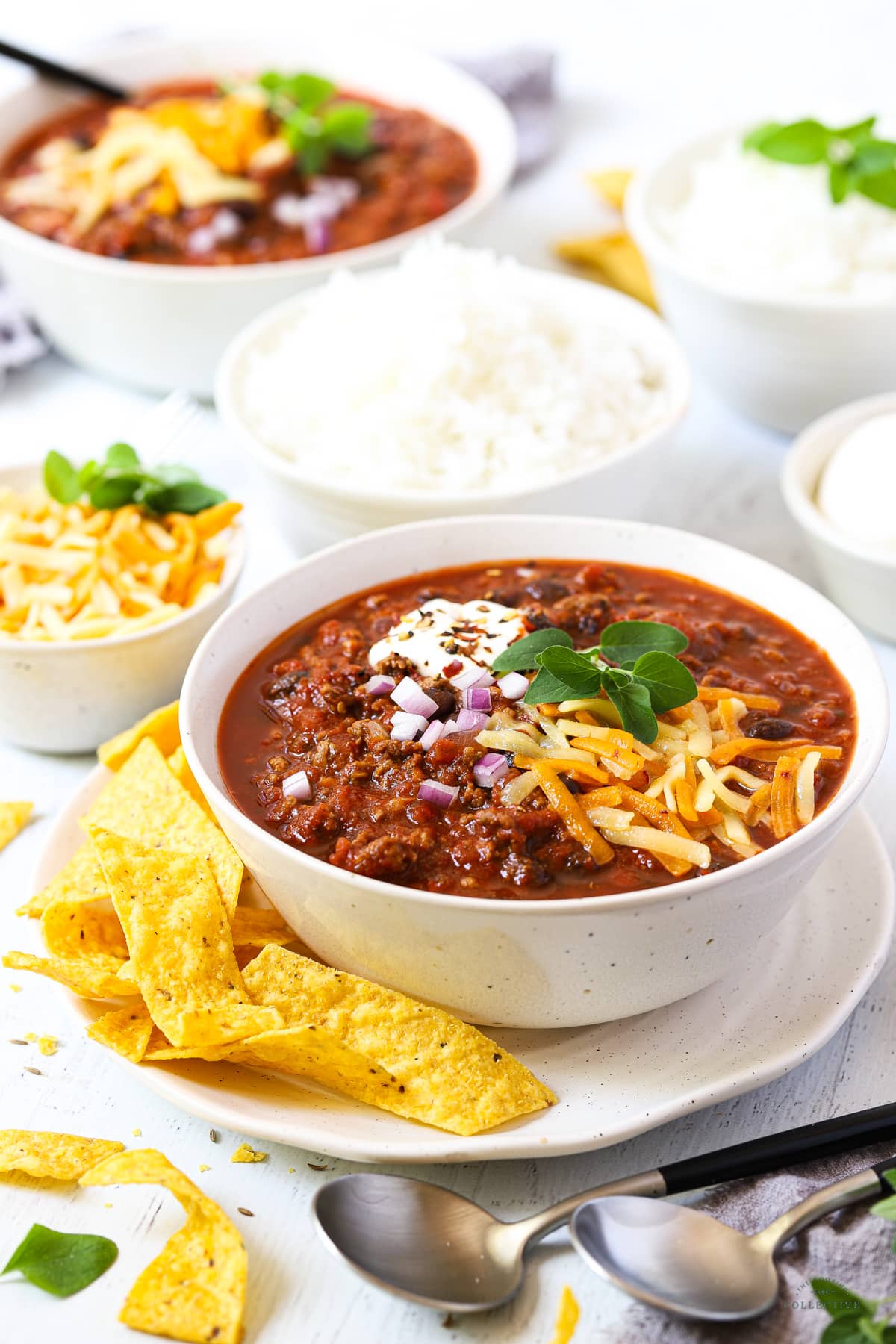 a bowl of chilli con carne topped with cheese