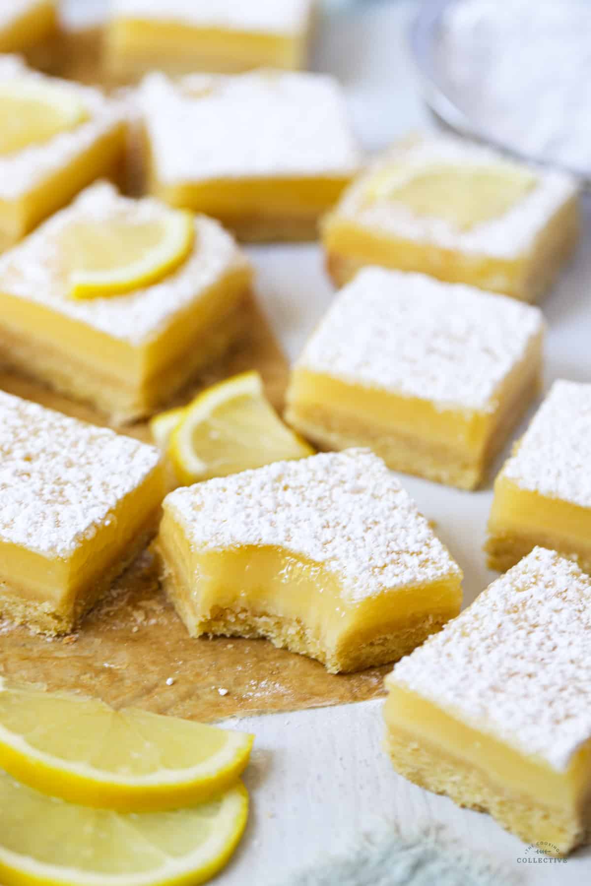 a lemon curd square with a bite taken from the corner