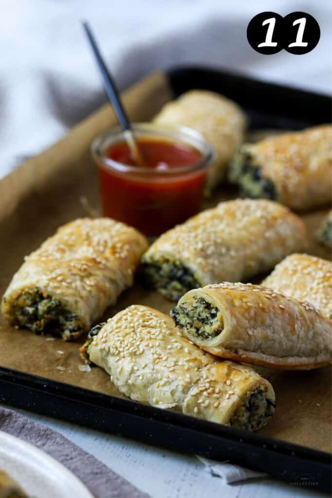 finished spinach and ricotta rolls on a baking tray