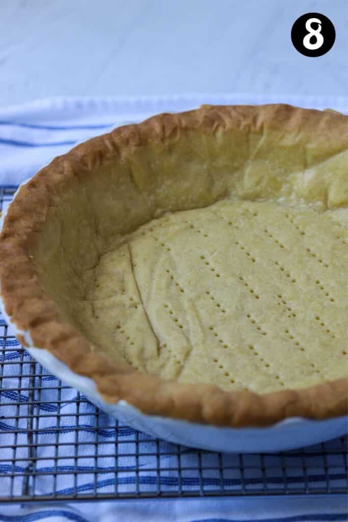 finished pie crust in a baking dish
