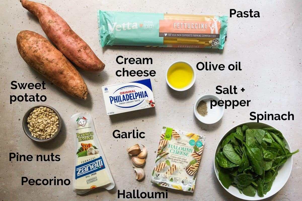 all ingredients for cream cheese pasta laid out on a table