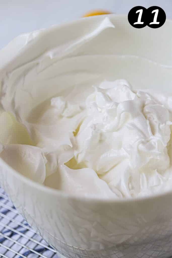 finished meringue whipped in white bowl
