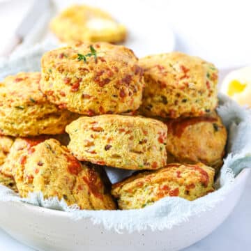 savoury scones stacked in a white bowl
