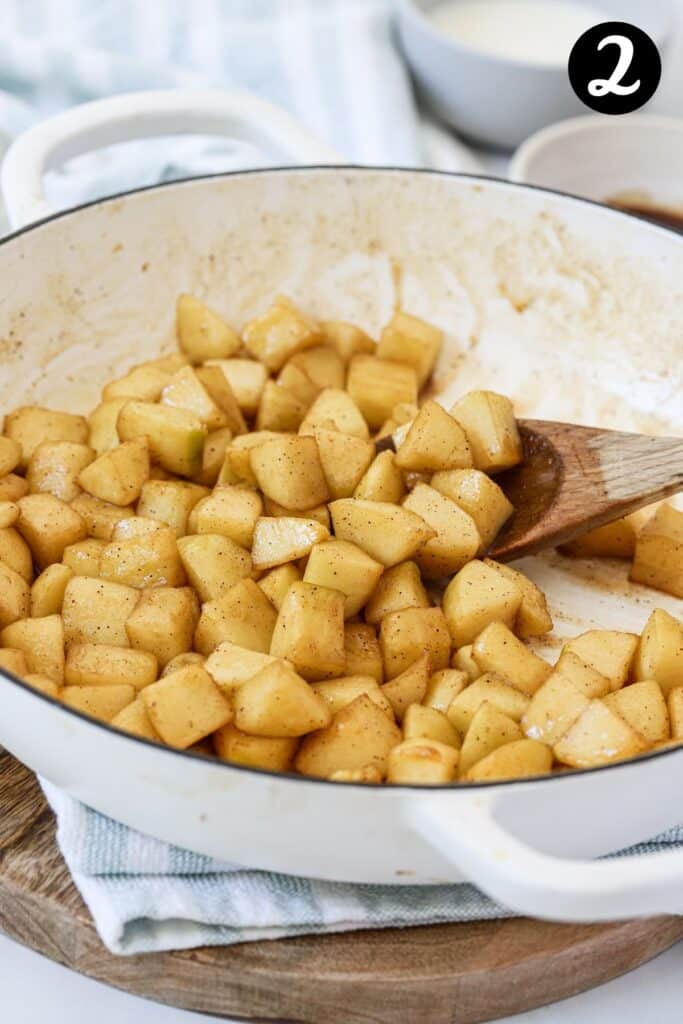 caramelised apples in a white pan