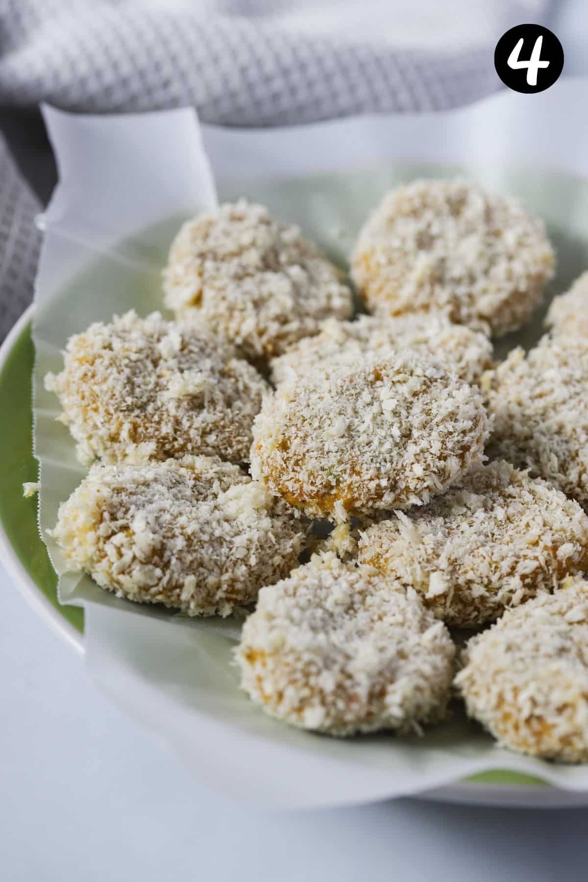 nuggets coated in panko breadcrumbs on a green plate