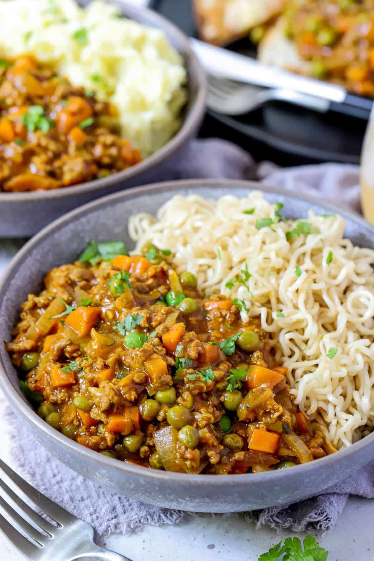 mince, veggies and noodles in a grey bowl