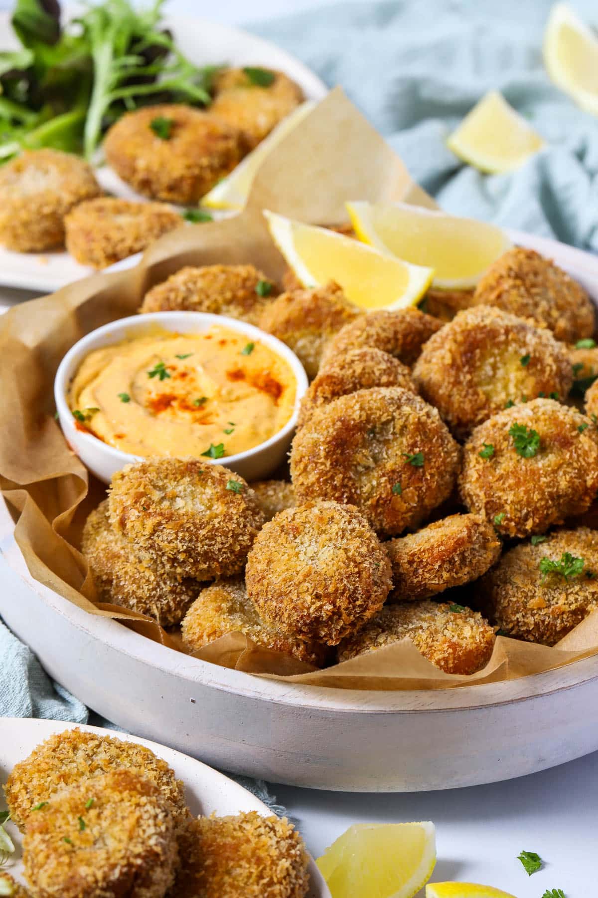 veggie nuggets in a white bowl with dipping sauce