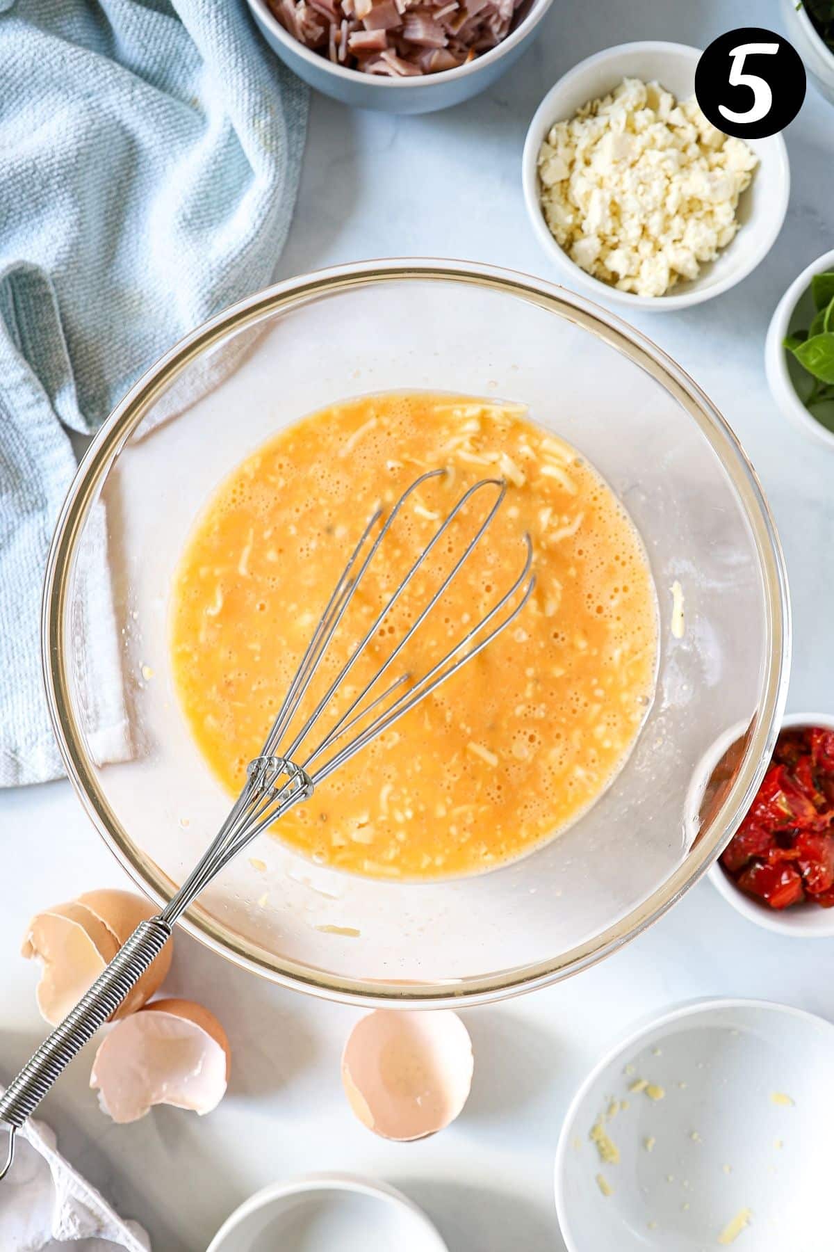 egg mixture for quiche in a glass bowl