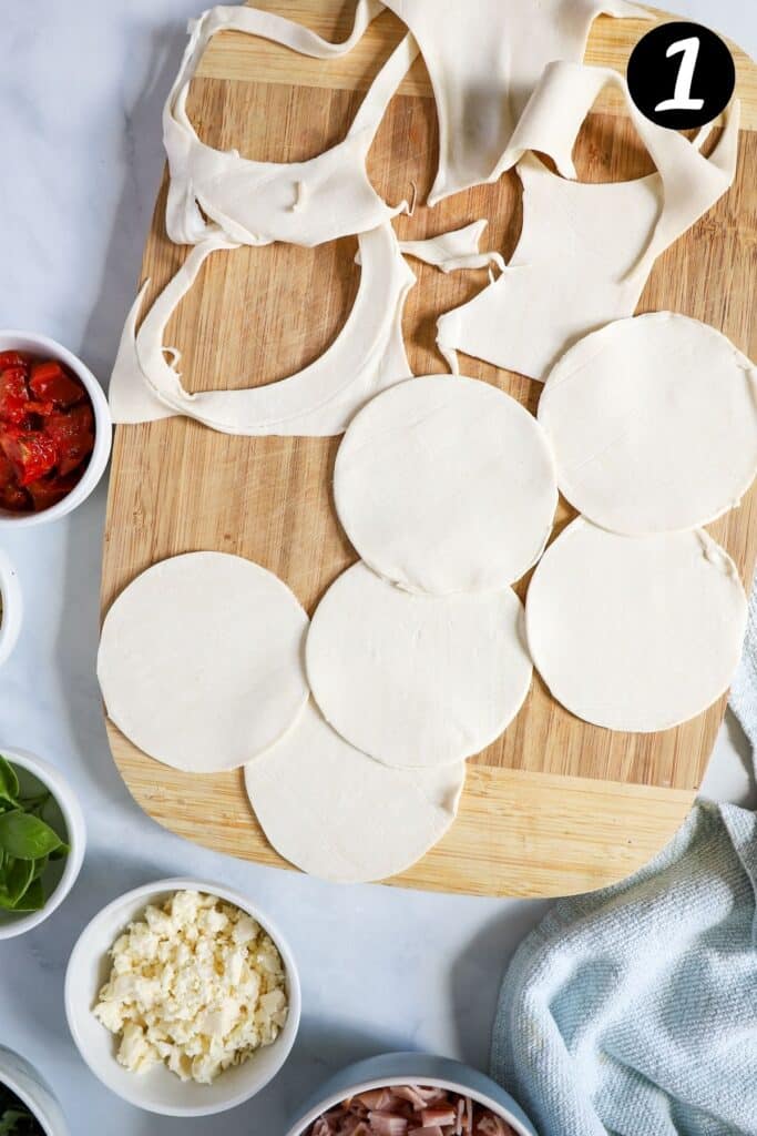 puff pastry circles cut-out on a wooden board