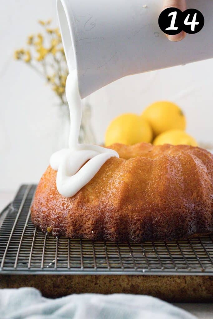 a jug pouring lemon glaze over a cake