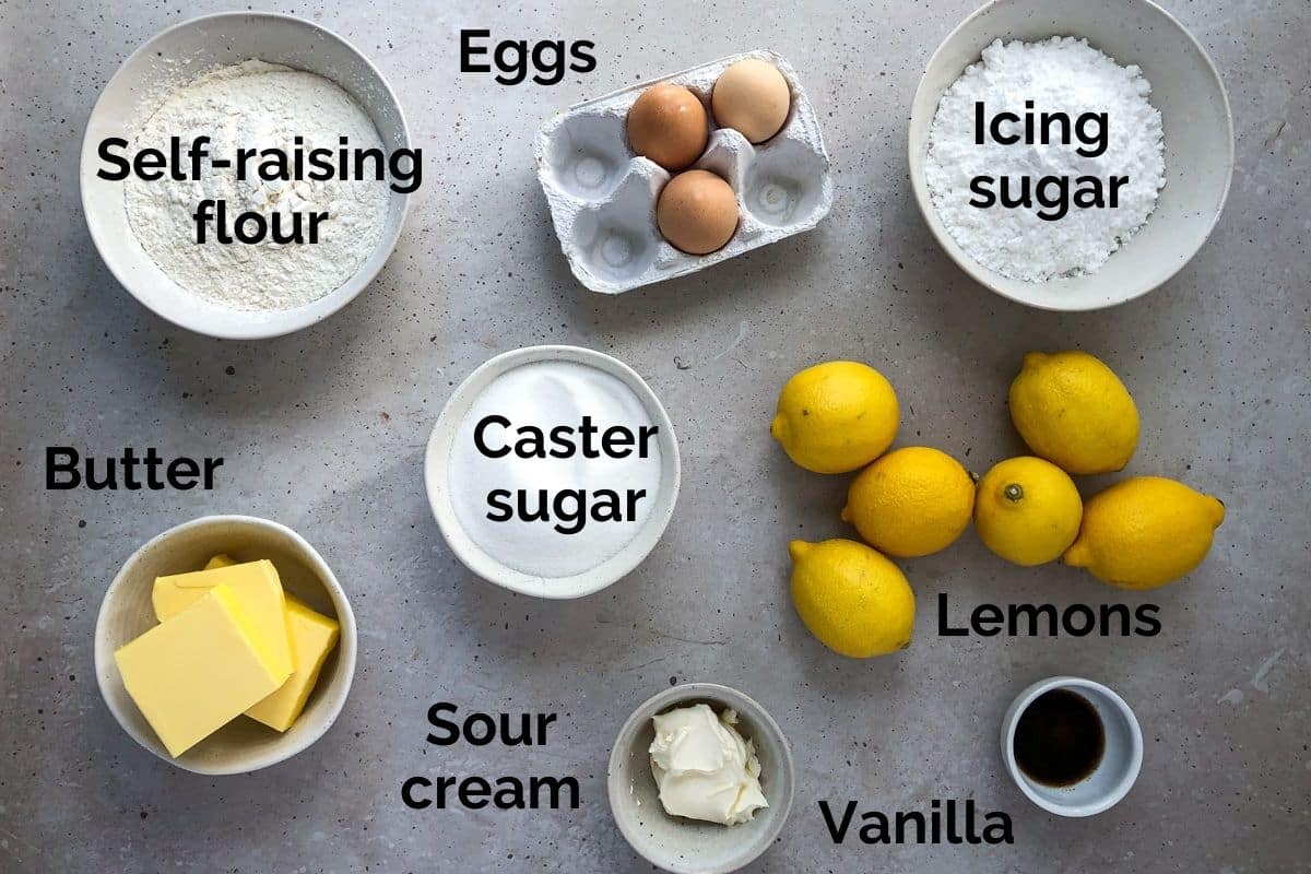 all ingredients for lemon syrup cake laid out on a table