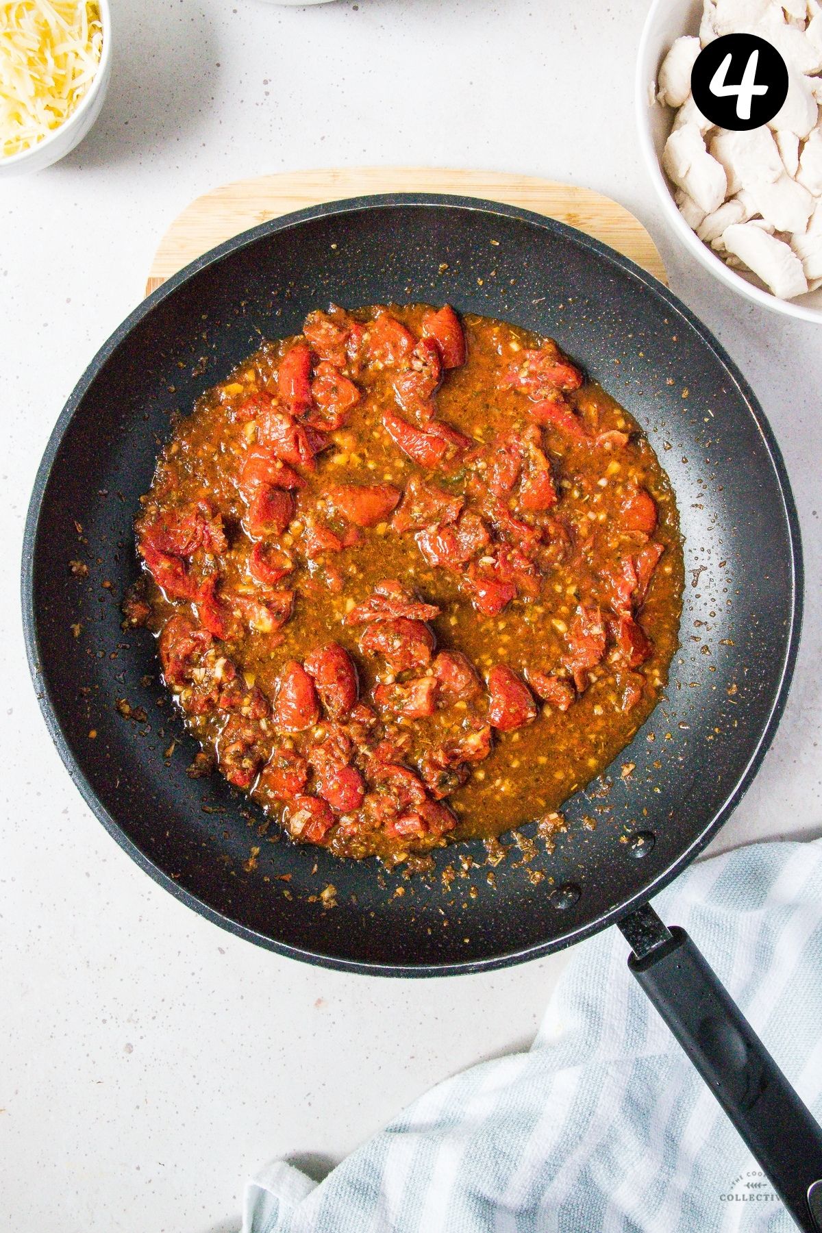 sun dried tomatoes in a tomato sauce in a frying pan.