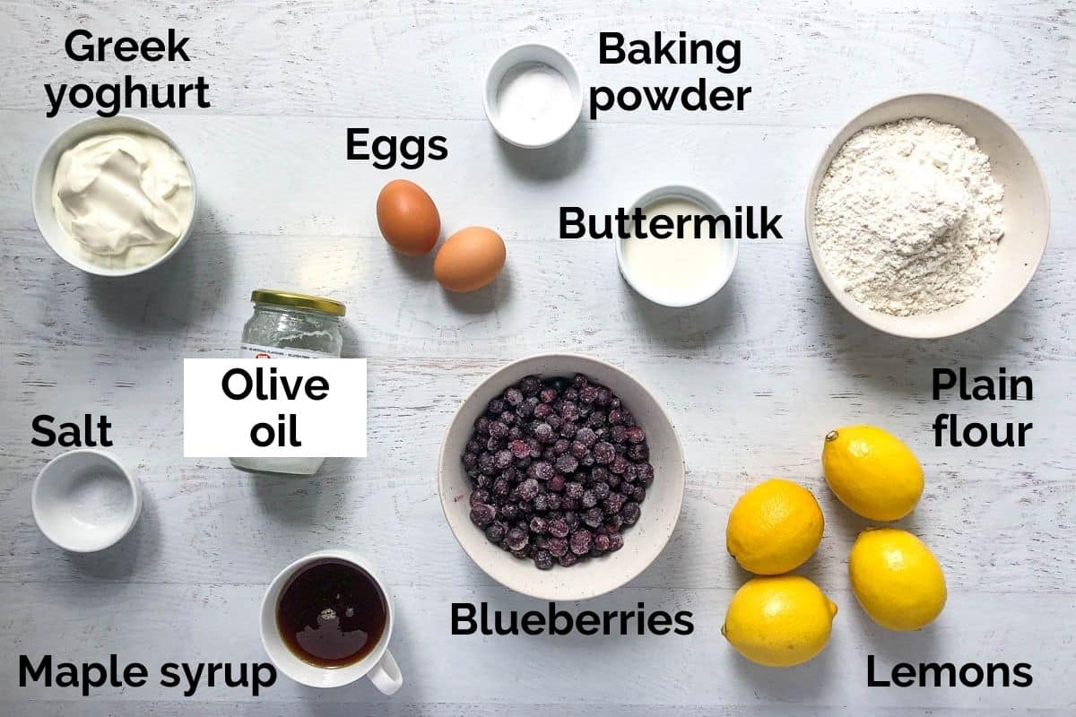 all ingredients for lemon blueberry yoghurt muffins laid out on a table
