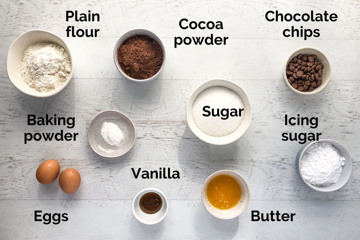 all ingredients for brownie crinkle cookies laid out on a table