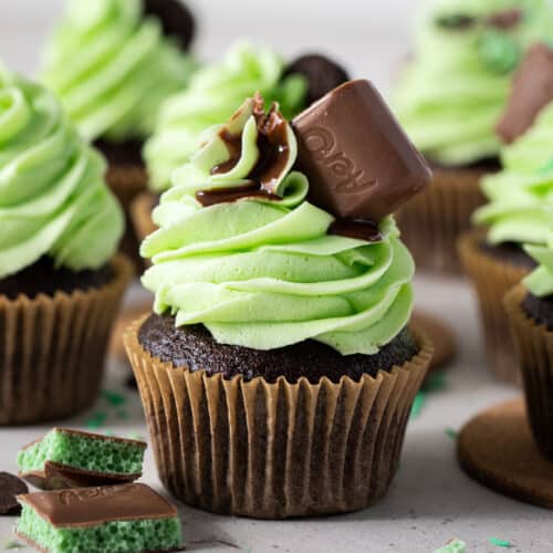 mint aero cupcakes with green frosting on a white table