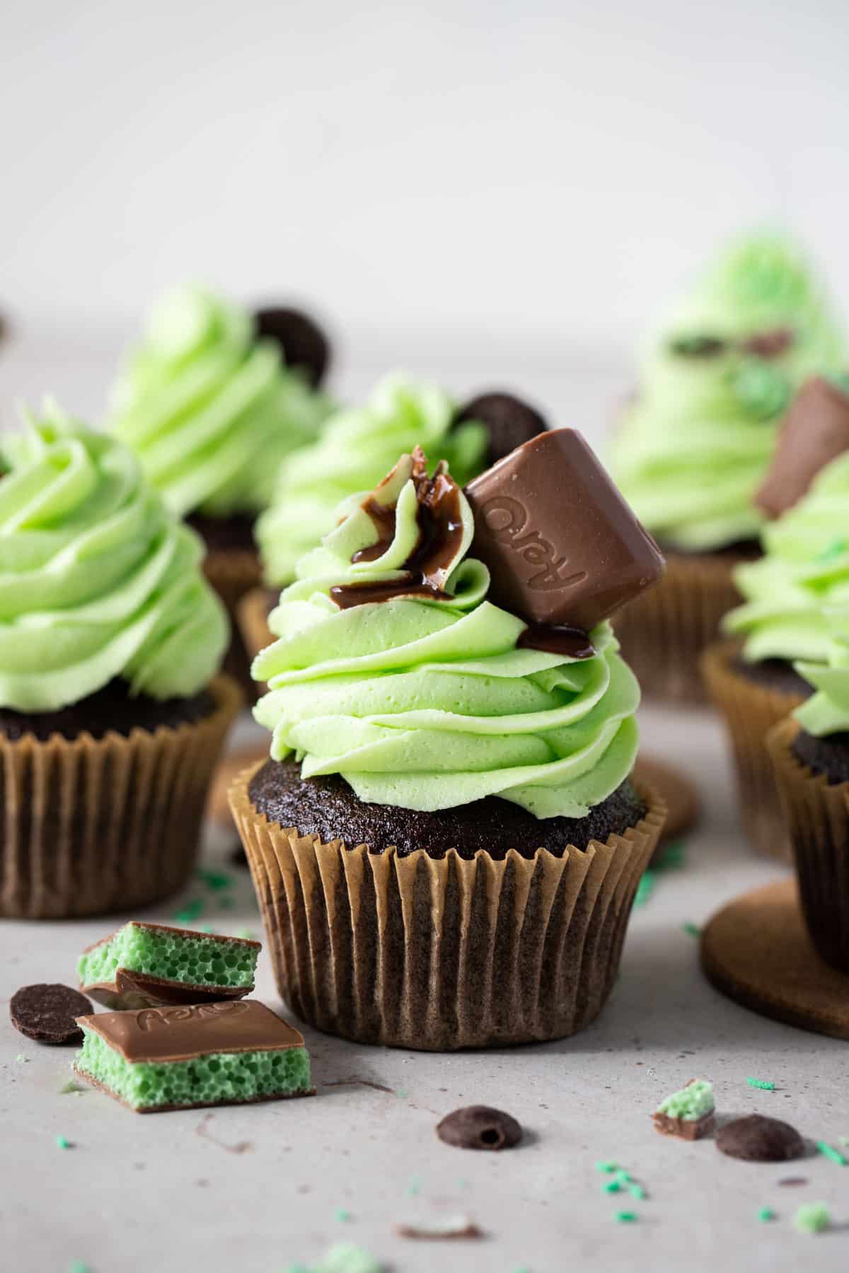mint aero cupcakes on a white table with chocolate.