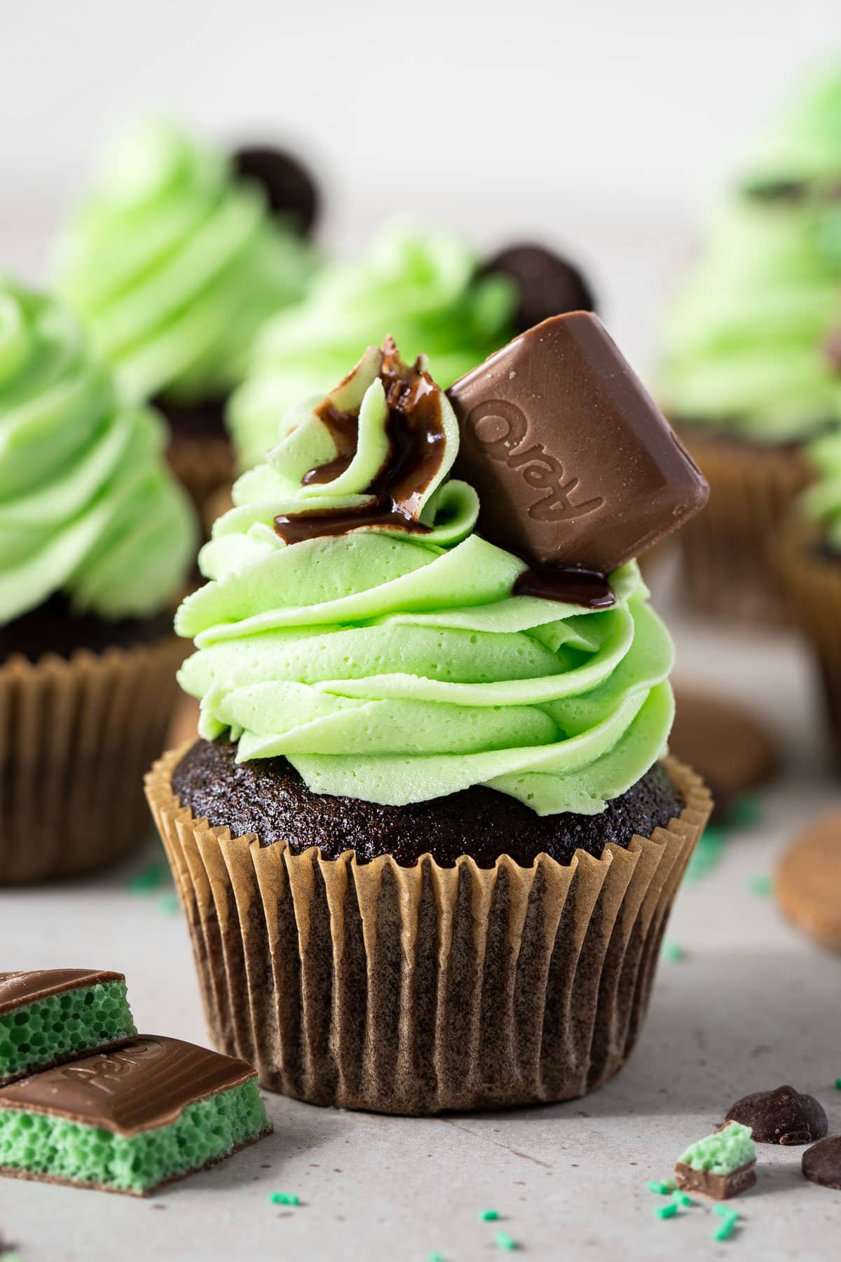 a chocolate cupcake topped with mint buttercream and aero chocolate