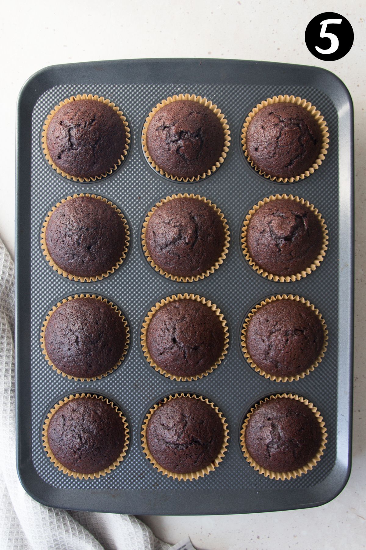 finished cupcakes in a cupcake tray.