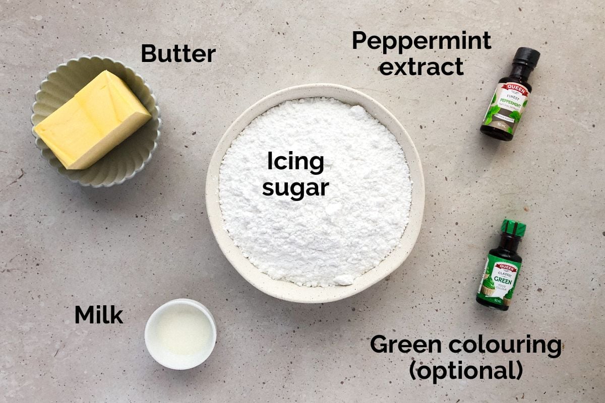 all ingredients for mint buttercream, laid out on a table.