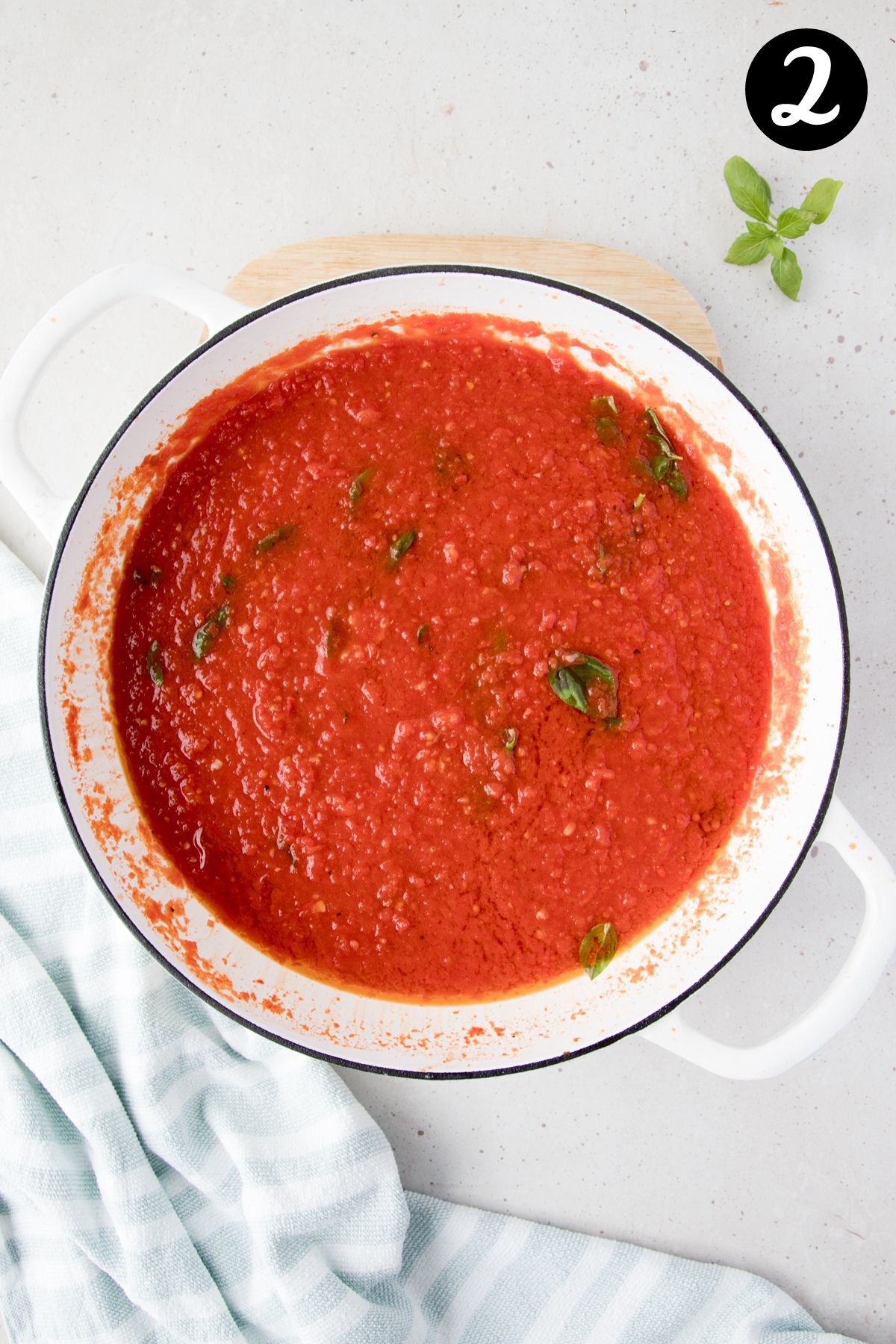 tomato pasta sauce in a white pan.