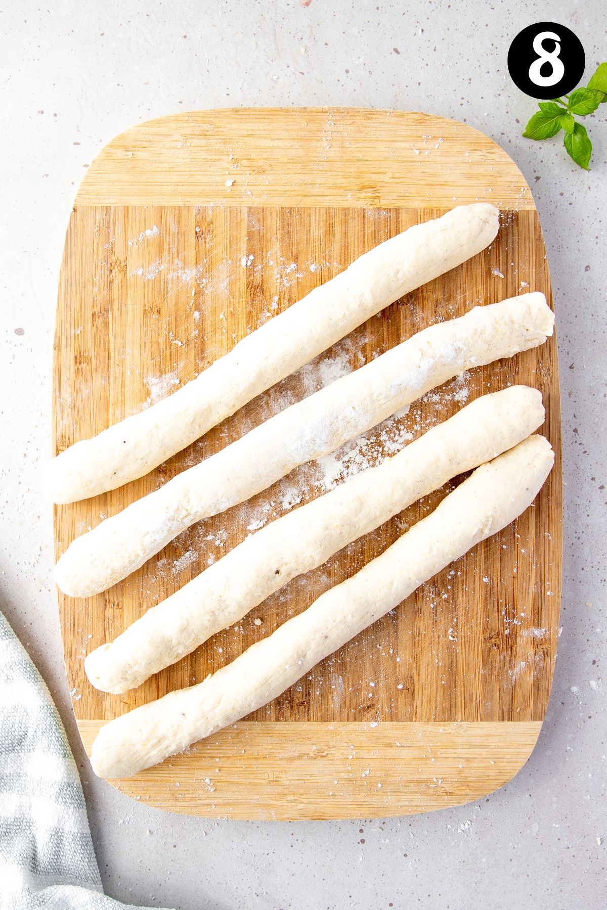 dough rolled into four rope-shaped pieces.