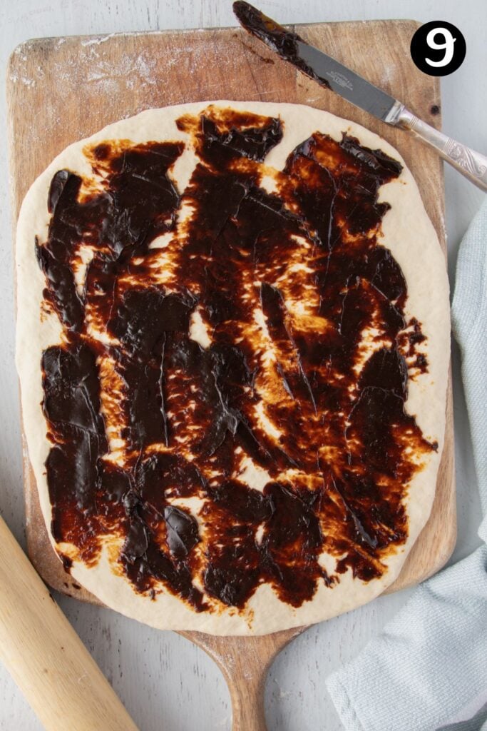 vegemite spread over rolled dough. 