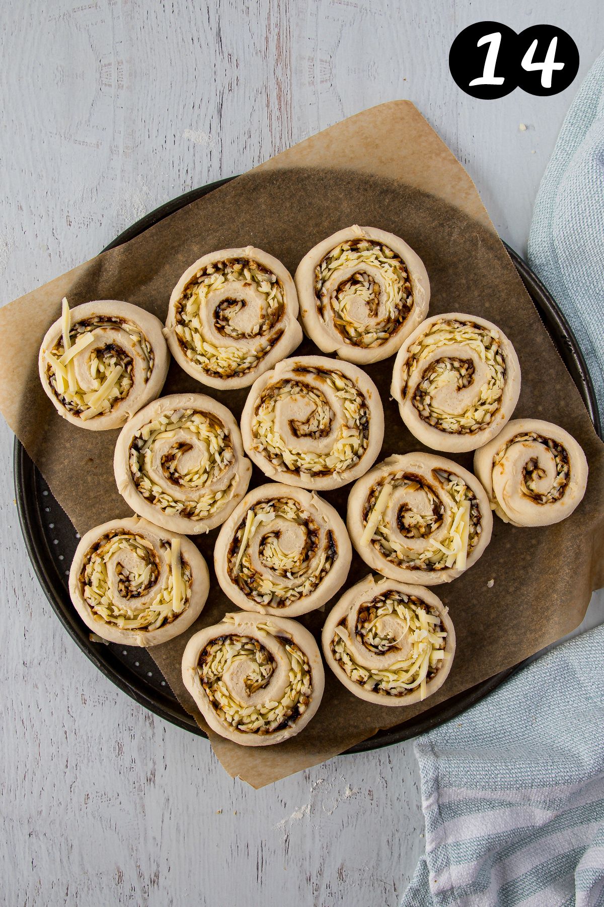 cheese and vegemite scrolls on a baking tray