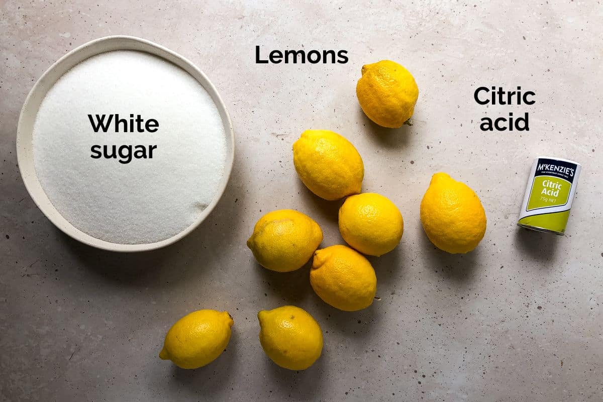 all ingredients for lemon cordial, laid out on a table.