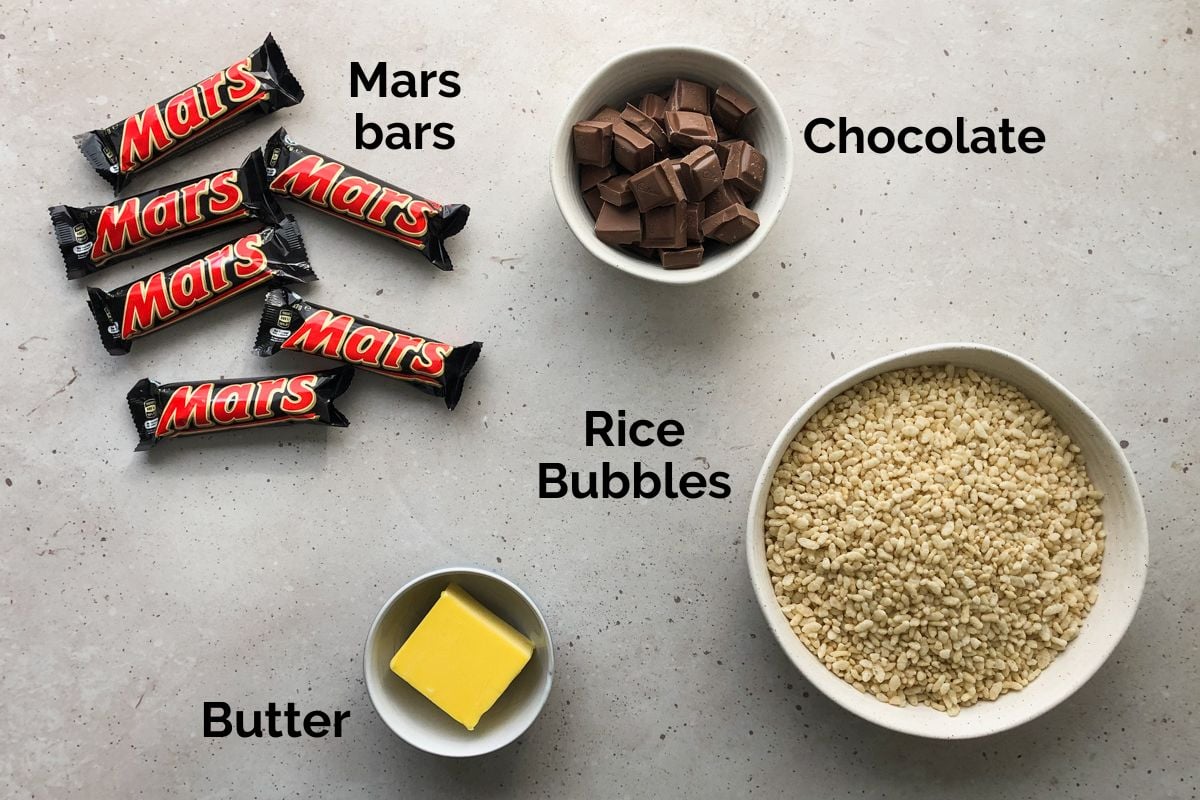 all ingredients for mars bar slice, laid out on a table.