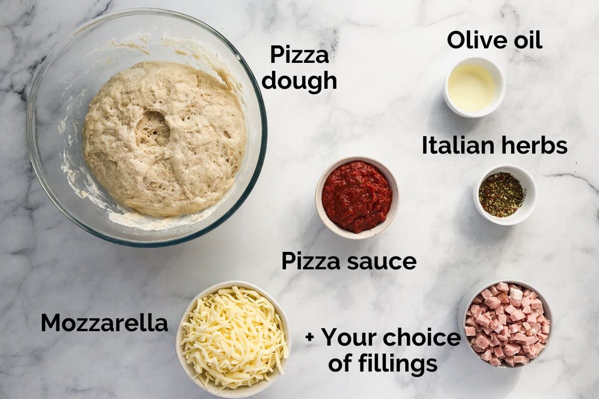 all ingredients for pizza pockets laid out on a table.