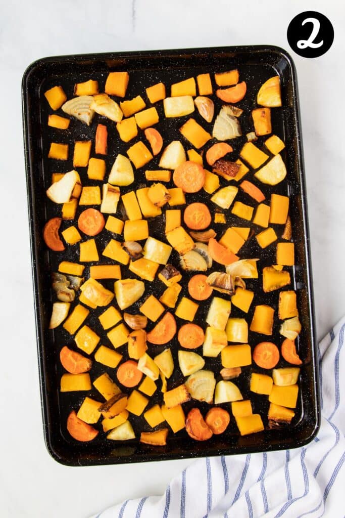 roasted vegetables on a baking tray.