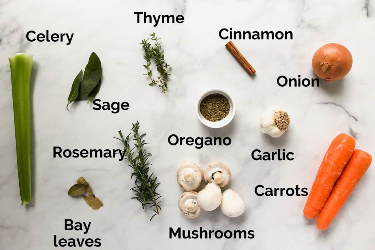 vegetables and ingredients for ragu laid out on a table.