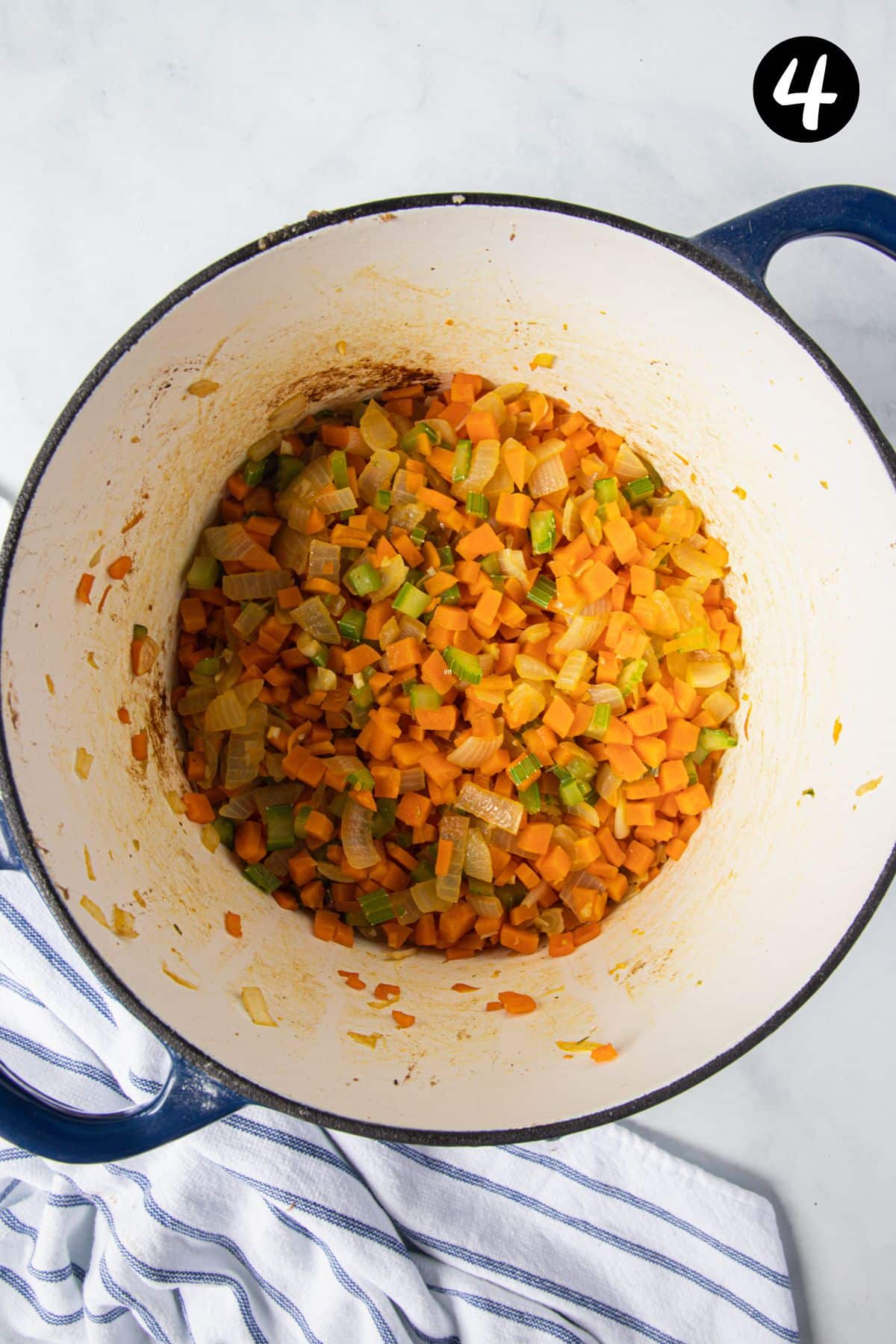 seared vegetables in a pot.