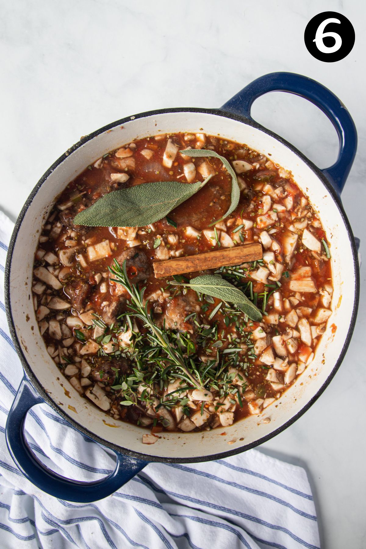 ragu ingredients in a dutch oven.