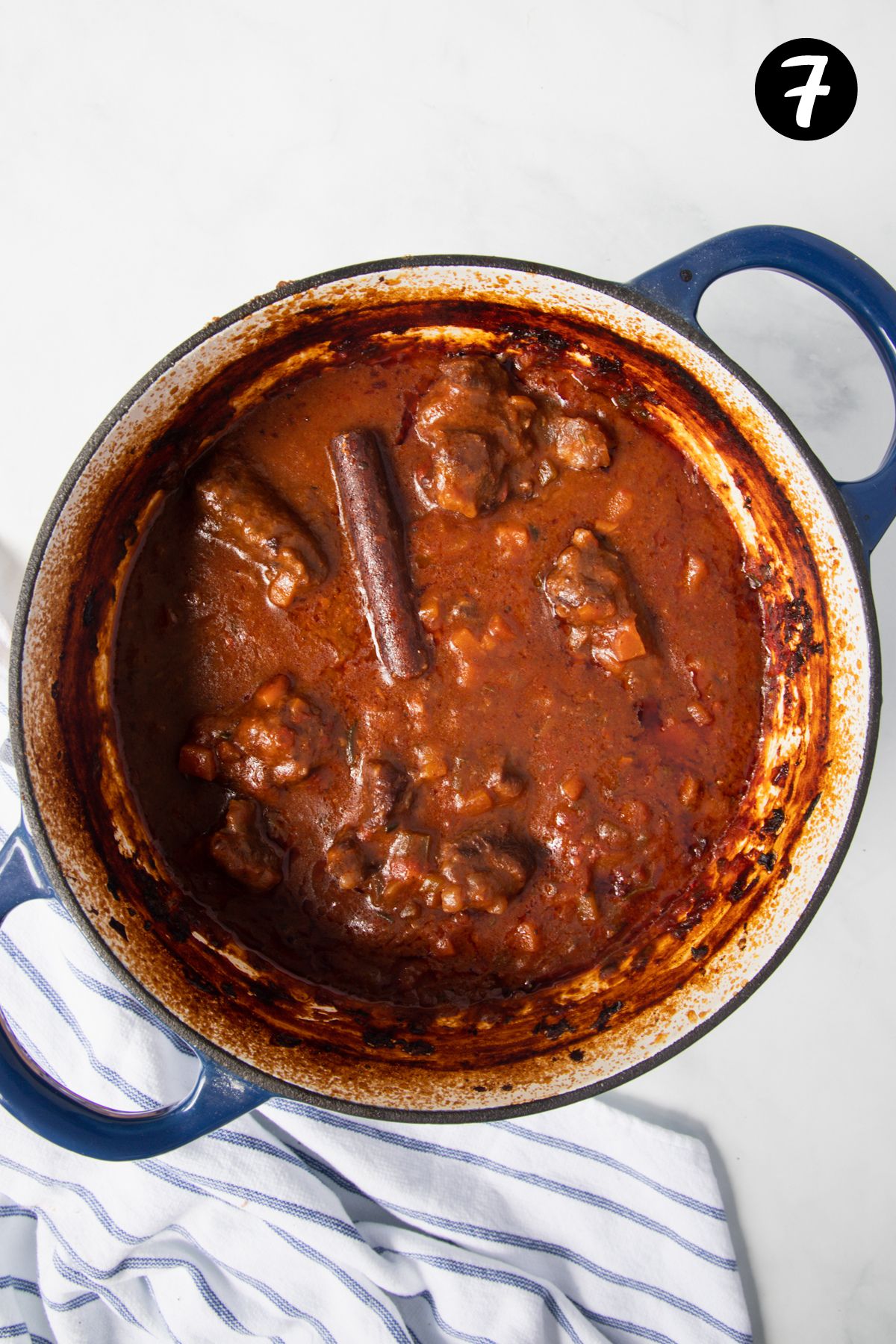 cooked ragu in a Dutch oven.