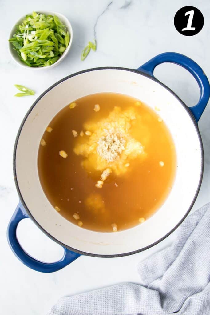 chicken stock and soup ingredients in a pot.