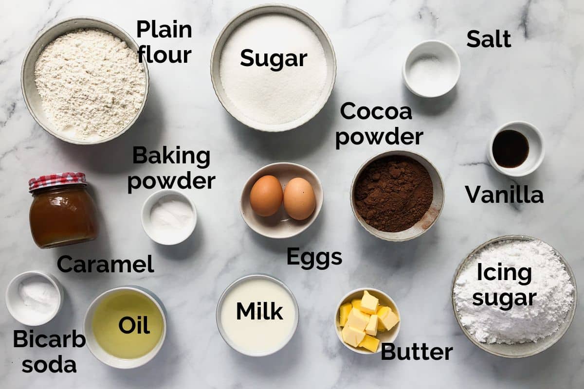 all ingredients for chocolate caramel cake, laid out on a table.