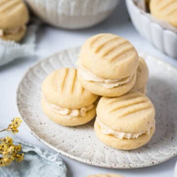 a plate of melting moments biscuits, filled with vanilla buttercream.