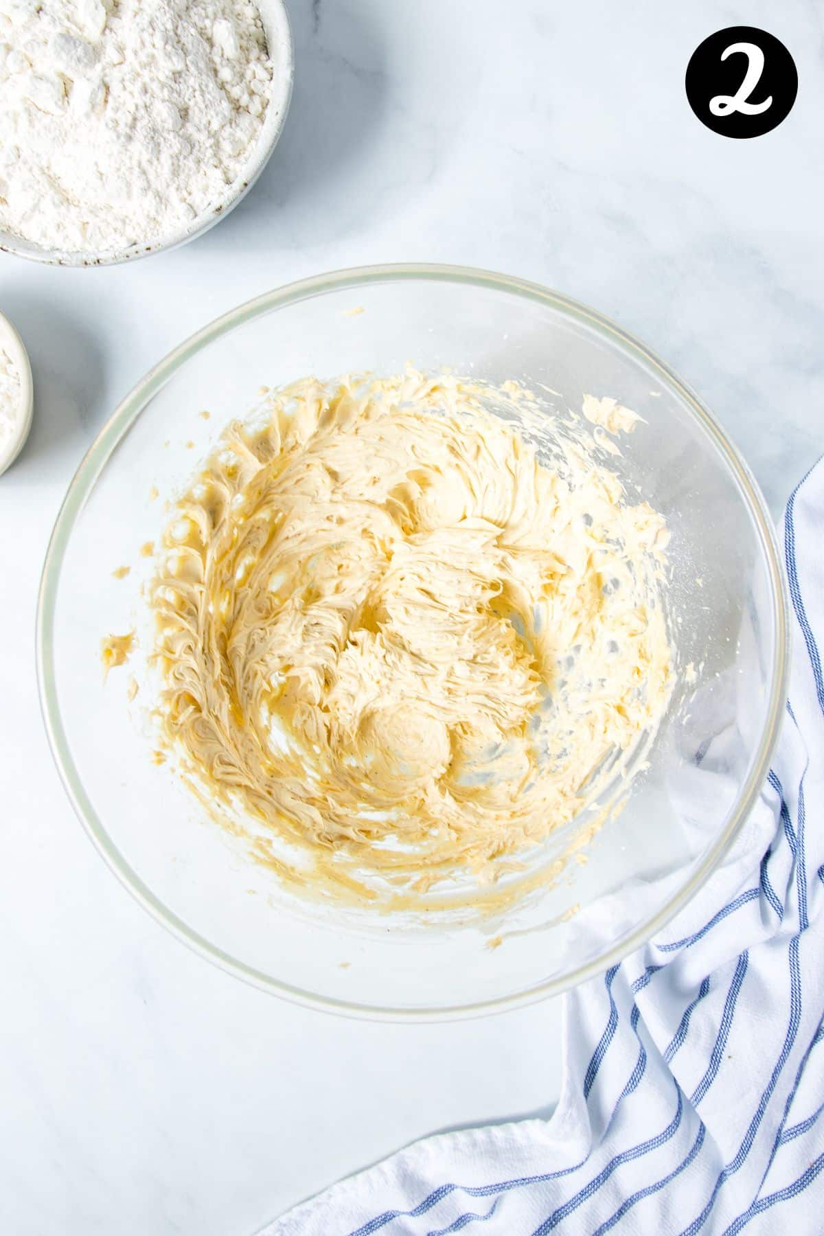 creamed butter and icing sugar in a bowl.