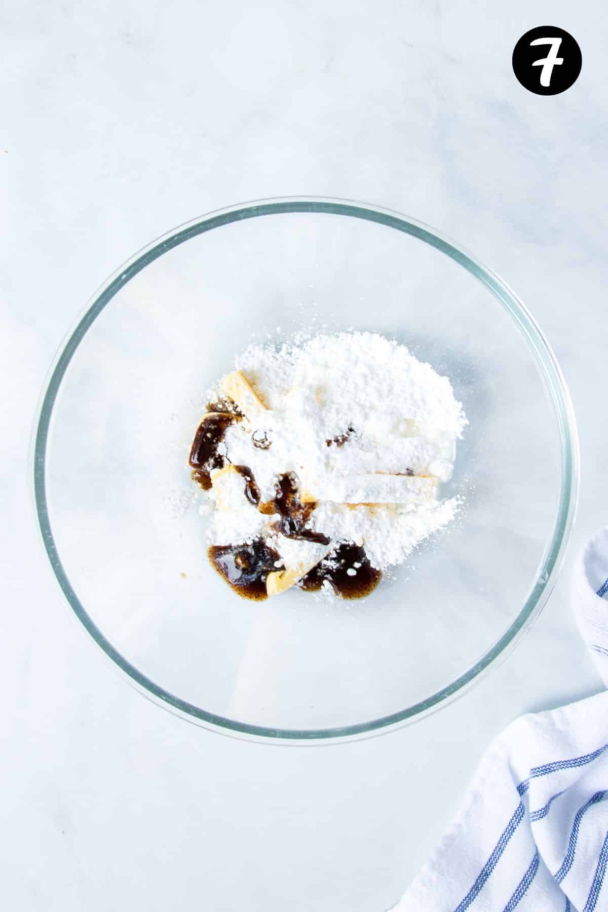 buttercream icing ingredients together in a mixing bowl.