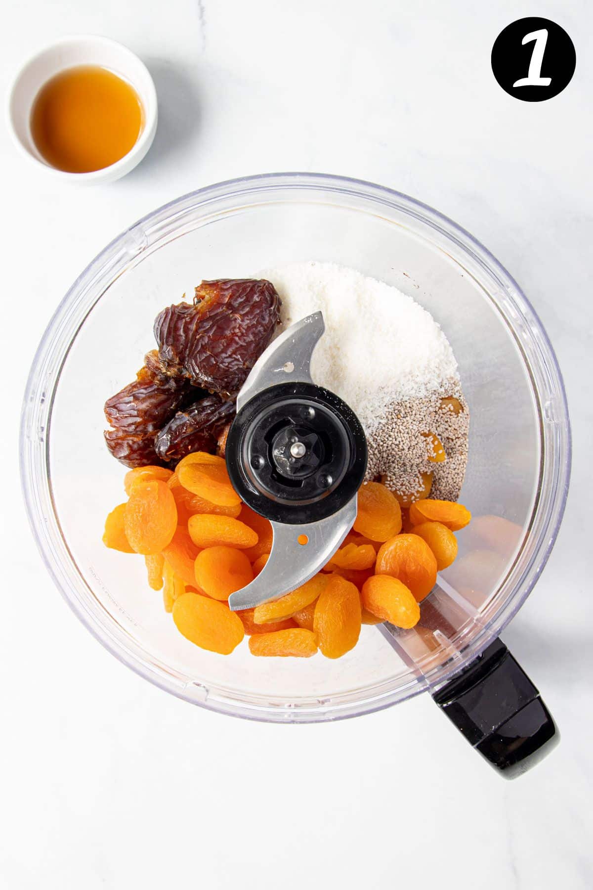 ingredients for apricot bliss balls in a food processor