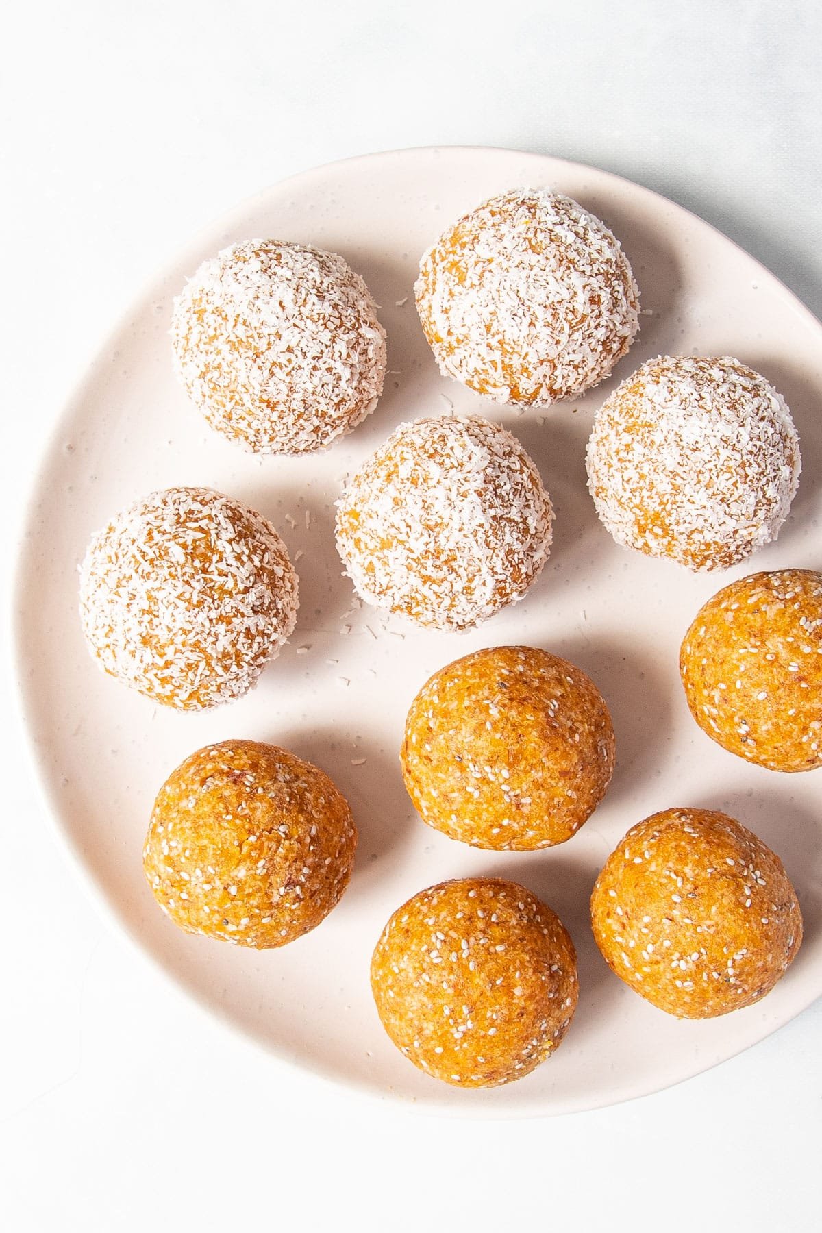 bliss balls on a white plate.