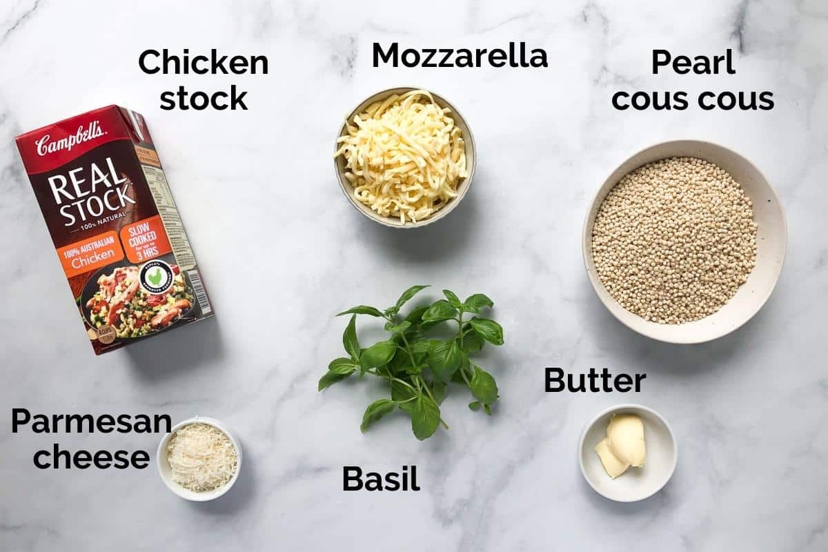 ingredients for pearl couscous, laid out on a table.