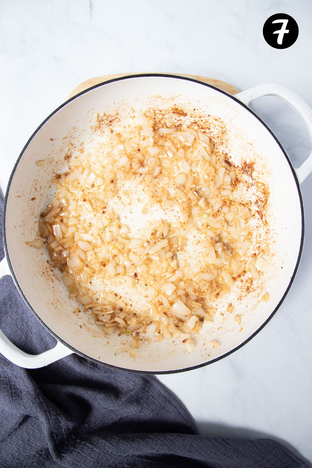 onion and garlic frying in a pan.