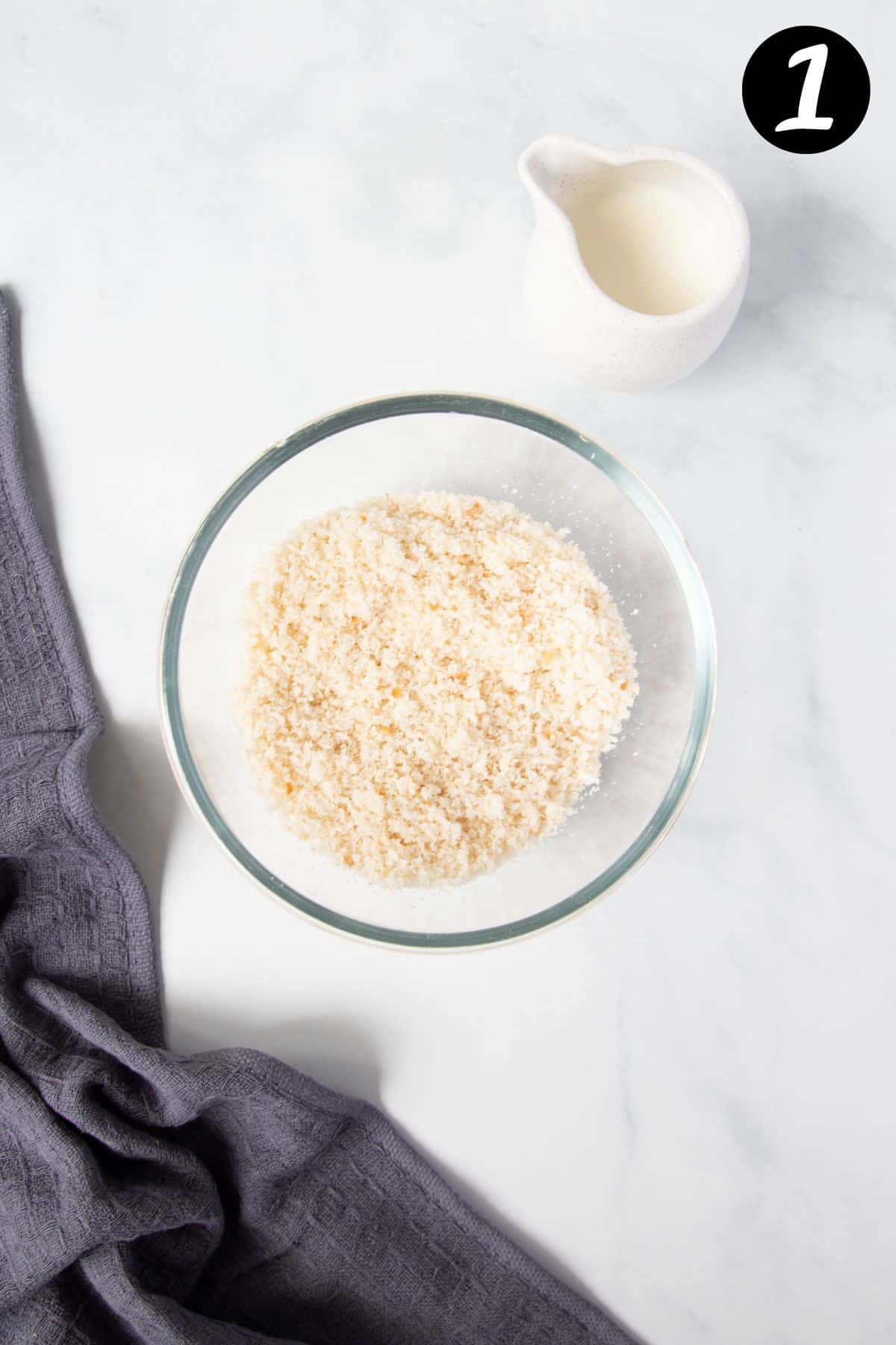 fresh breadcrumbs in a mixing bowl on a table.