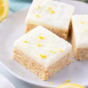 pieces of lemon slice arranged on a white plate.