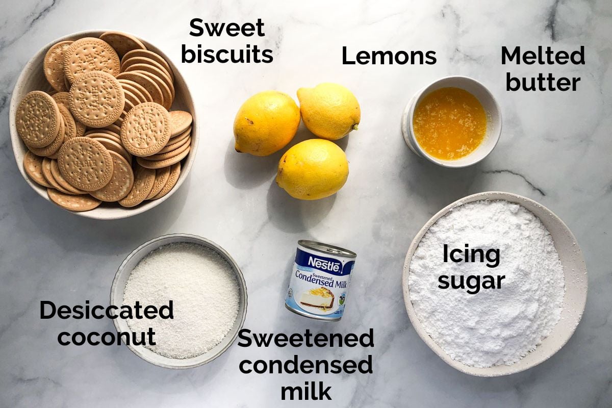 all ingredients for lemon coconut slice, laid out on a table.