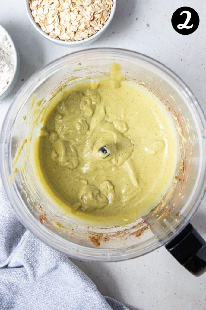 a smooth, blended banana and avocado mixture in a food processor.