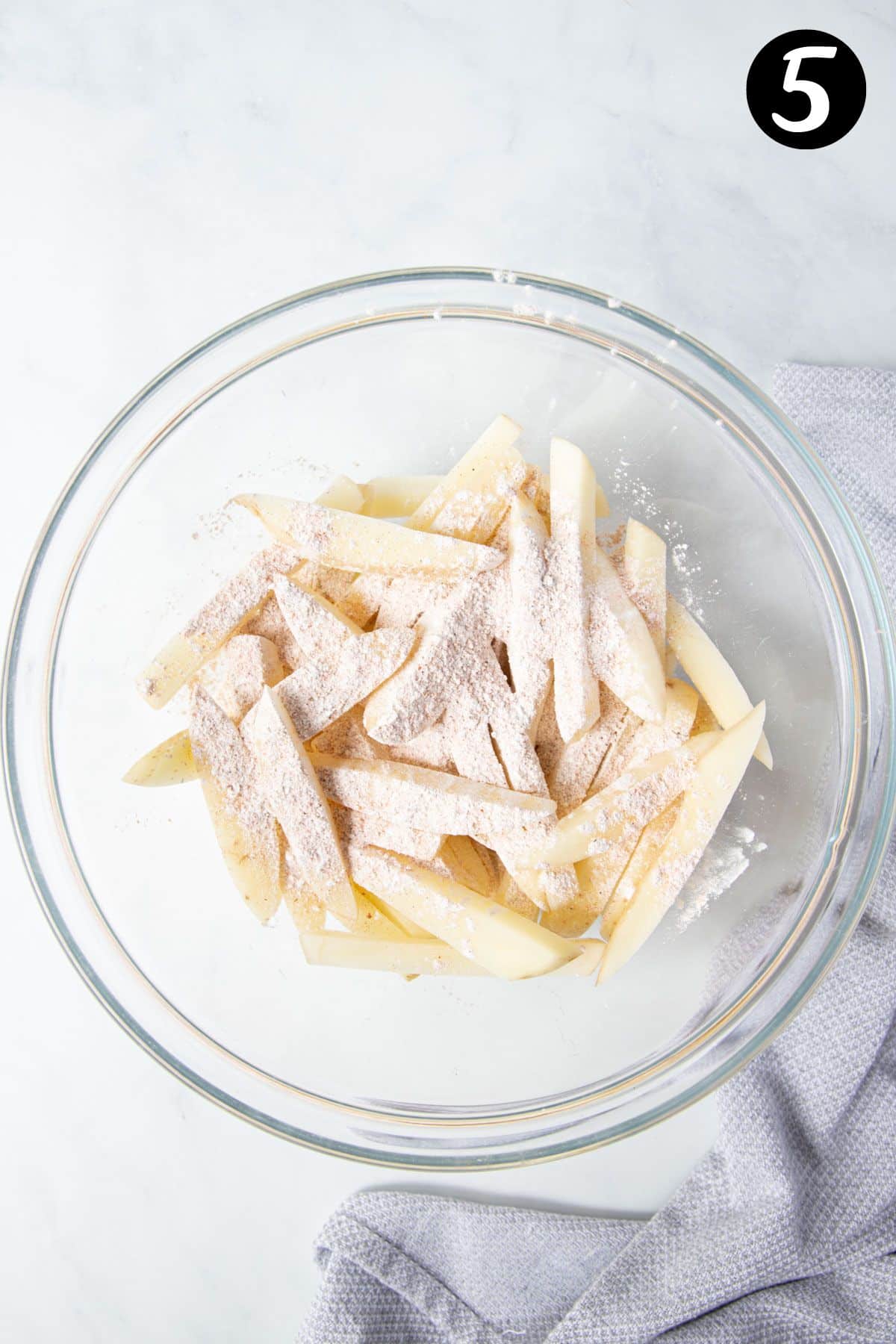 a bowl of chips coated with cornflour and salt, in a bowl.